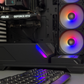 Gaming computer setup with ASUS GeForce RTX graphics card and RGB lighting